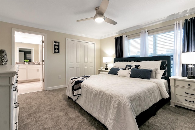 bedroom with ensuite bathroom, ornamental molding, light colored carpet, ceiling fan, and a closet