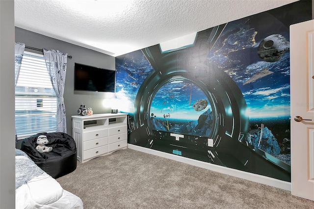 carpeted cinema room featuring a textured ceiling