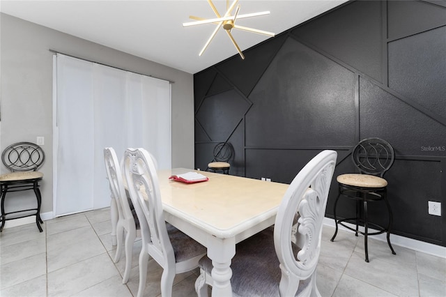 dining room featuring a notable chandelier and light tile patterned floors