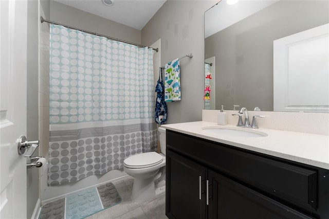 full bathroom with vanity, shower / tub combo, tile patterned flooring, and toilet