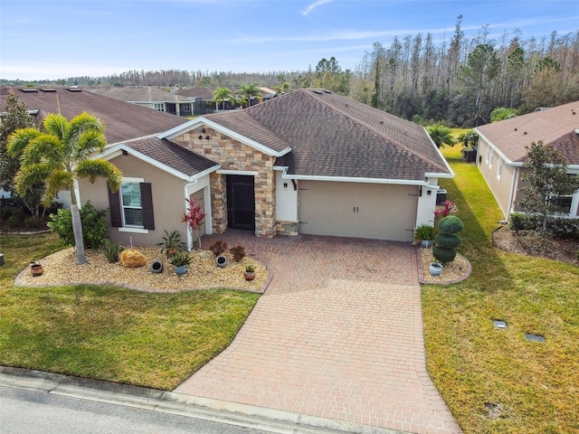 view of front of house with a garage and a front yard