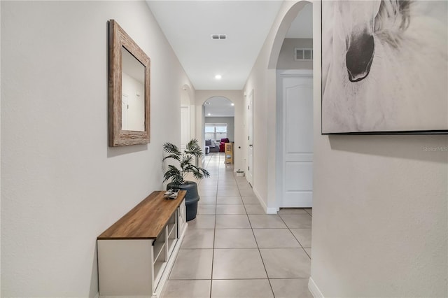 hallway with light tile patterned flooring