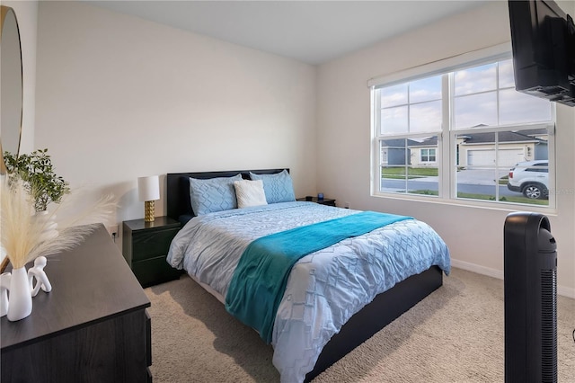 bedroom with light carpet