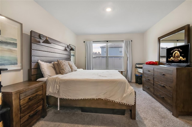 bedroom featuring light colored carpet