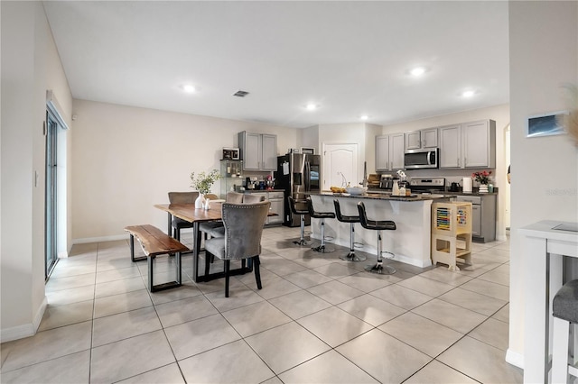 dining space with light tile patterned floors