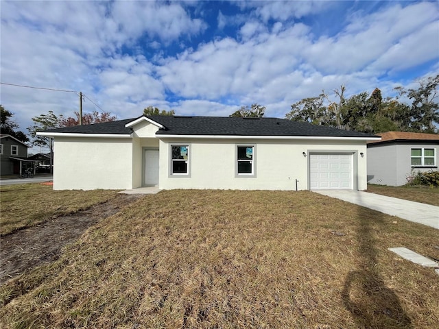 ranch-style home with a garage and a front yard