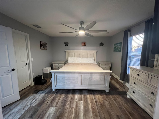 bedroom with dark wood-type flooring and ceiling fan