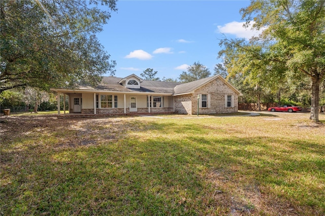 view of front of property with covered porch and a front yard