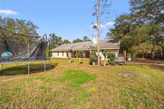 view of yard featuring a trampoline