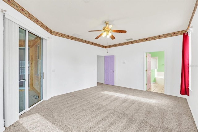 carpeted spare room with ceiling fan