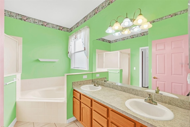 bathroom featuring tile patterned flooring, plus walk in shower, and vanity