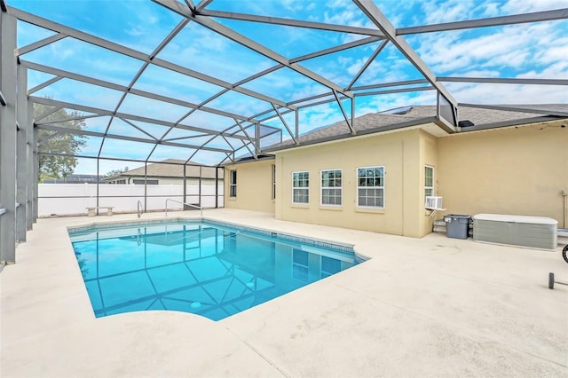 view of swimming pool featuring a lanai and a patio