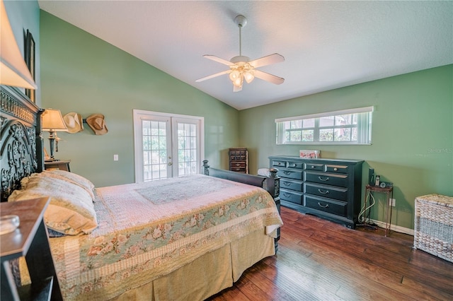 bedroom with ceiling fan, access to exterior, dark hardwood / wood-style flooring, vaulted ceiling, and french doors