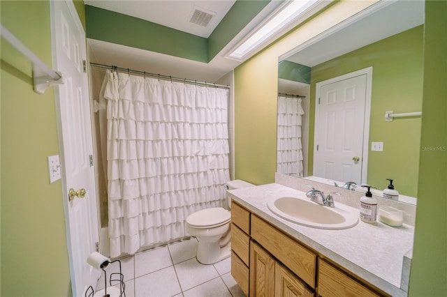 bathroom with a shower with curtain, vanity, toilet, and tile patterned flooring