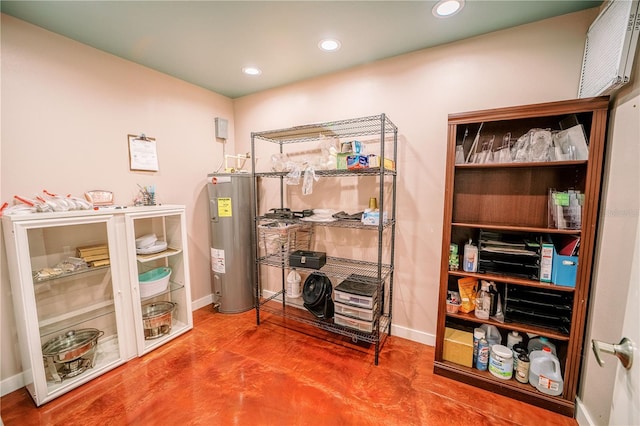 interior space with concrete flooring and electric water heater