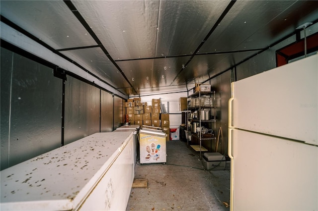 basement with white fridge