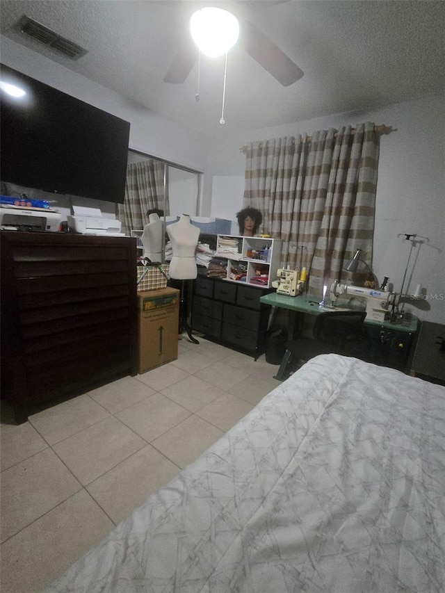 bedroom with light tile patterned floors and ceiling fan