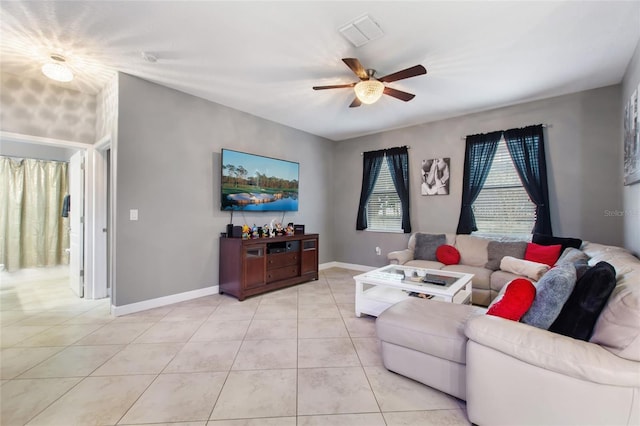 living room with ceiling fan and light tile patterned flooring