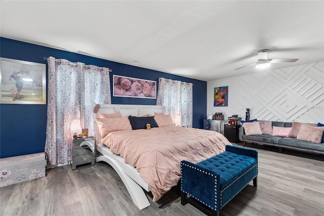 bedroom with hardwood / wood-style flooring and ceiling fan