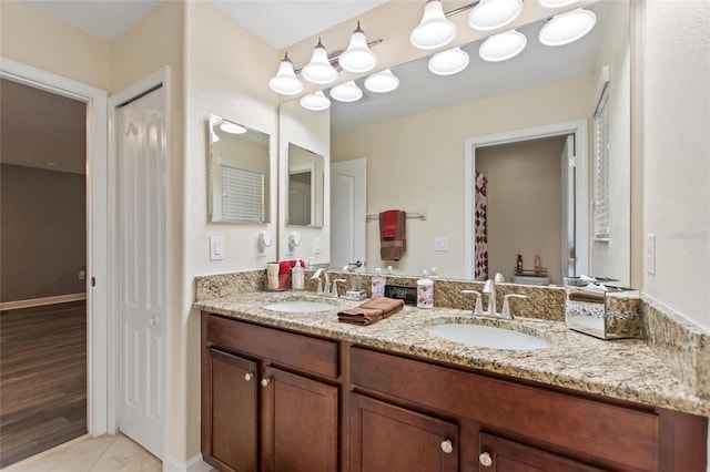 bathroom with vanity and tile patterned flooring