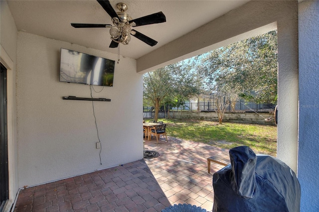 view of patio / terrace featuring ceiling fan