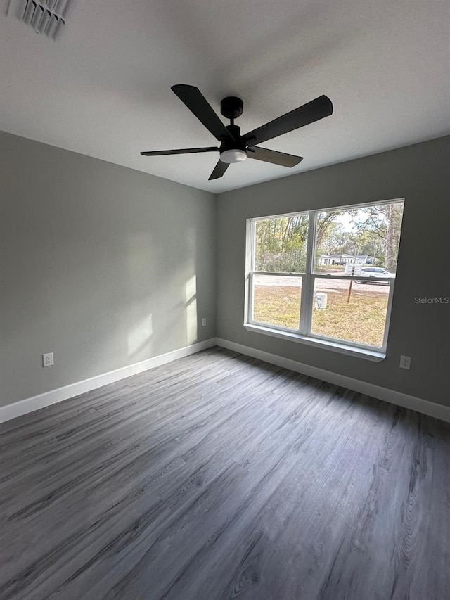 unfurnished room featuring ceiling fan and hardwood / wood-style floors