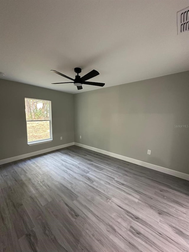 unfurnished room with ceiling fan and light hardwood / wood-style flooring