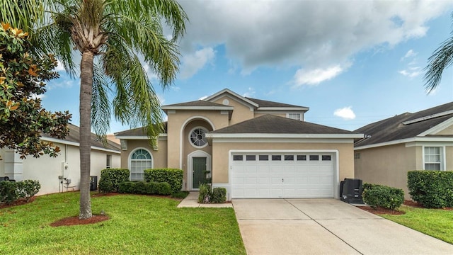 view of front of property with a garage and a front yard