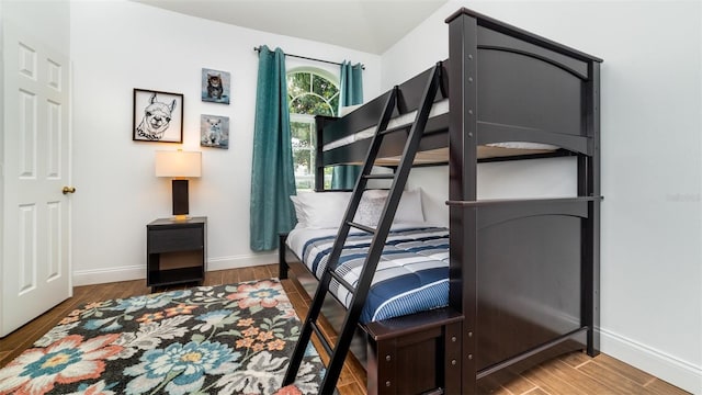 bedroom with wood-type flooring