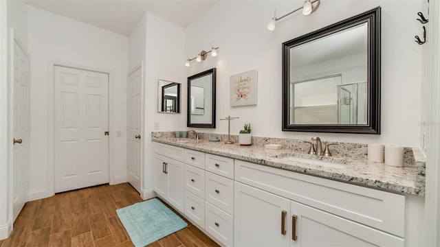 bathroom featuring vanity and hardwood / wood-style floors