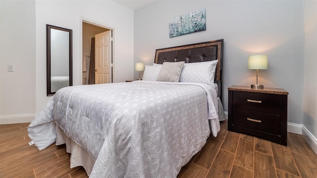 bedroom featuring dark hardwood / wood-style floors