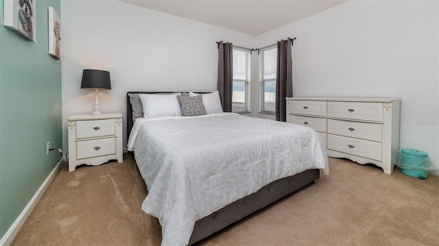 bedroom with light colored carpet