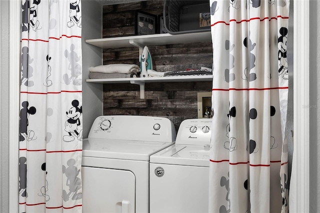 laundry area featuring hookup for a washing machine and wood walls