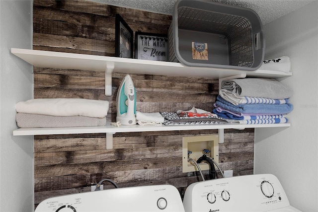 room details with washing machine and dryer and wood walls