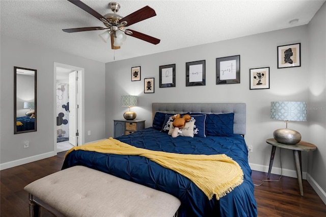 bedroom featuring ceiling fan, connected bathroom, dark hardwood / wood-style flooring, and a textured ceiling