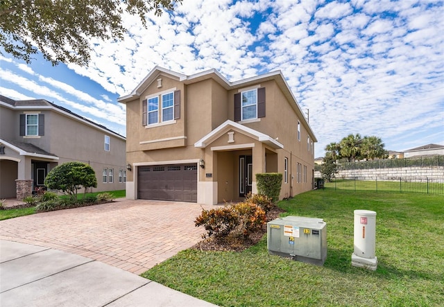 view of front of property featuring a garage and a front lawn