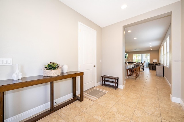 hallway featuring light tile patterned floors