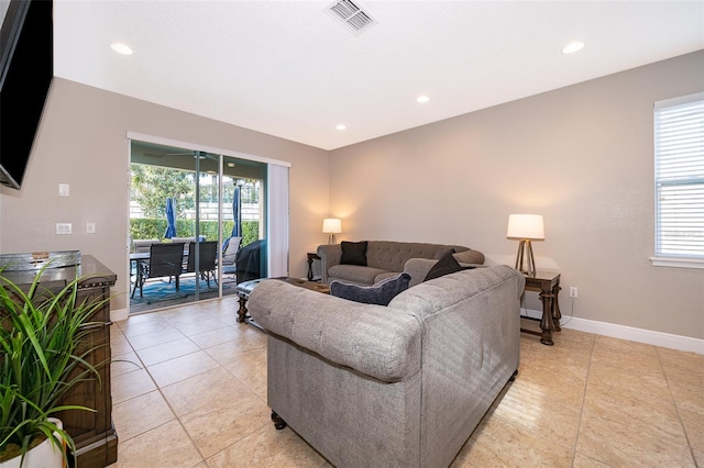 living room with light tile patterned flooring