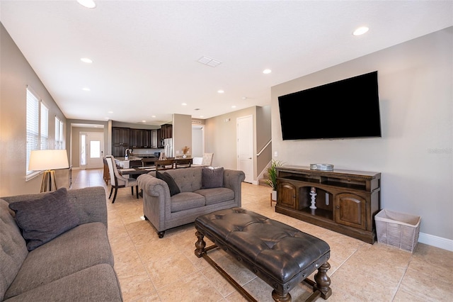 living room with light tile patterned flooring