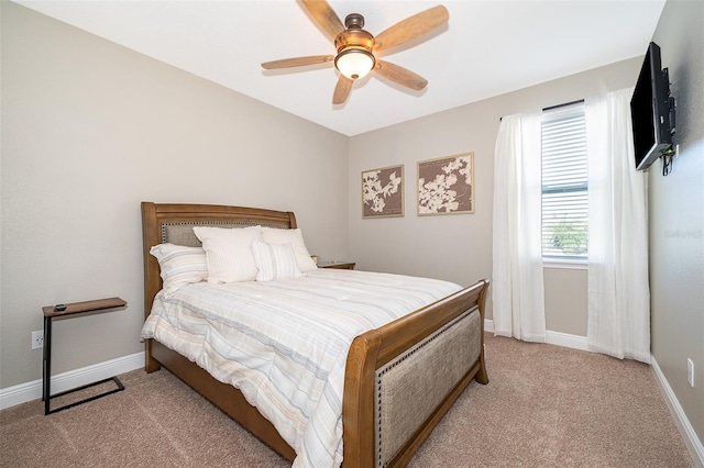 bedroom featuring light colored carpet and ceiling fan