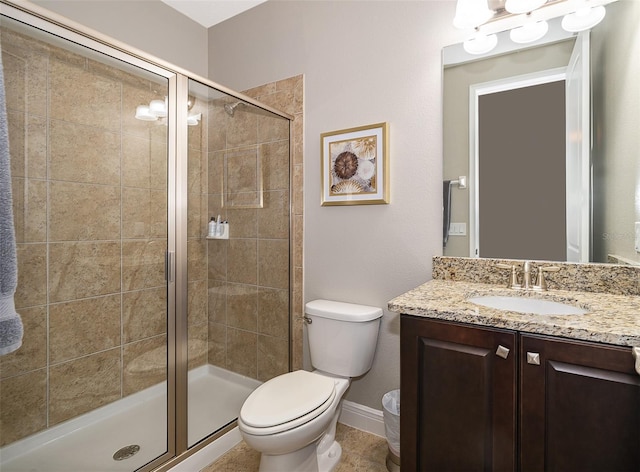 bathroom featuring vanity, toilet, and walk in shower