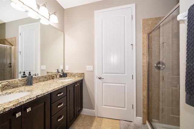 bathroom featuring vanity, tile patterned floors, a chandelier, and a shower with shower door