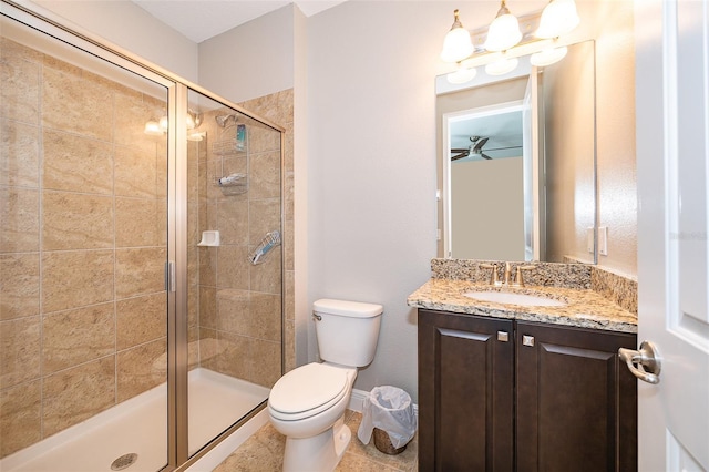 bathroom featuring vanity, toilet, and walk in shower