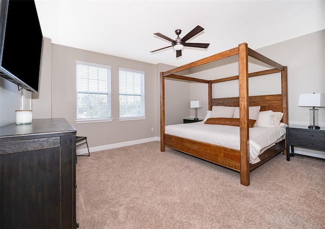 bedroom featuring light colored carpet and ceiling fan