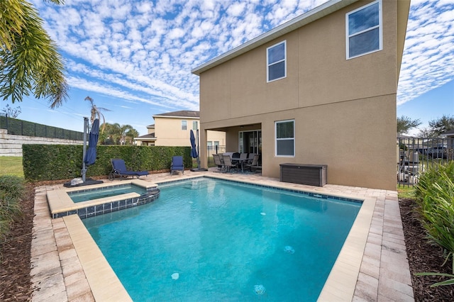 view of pool featuring an in ground hot tub and a patio area