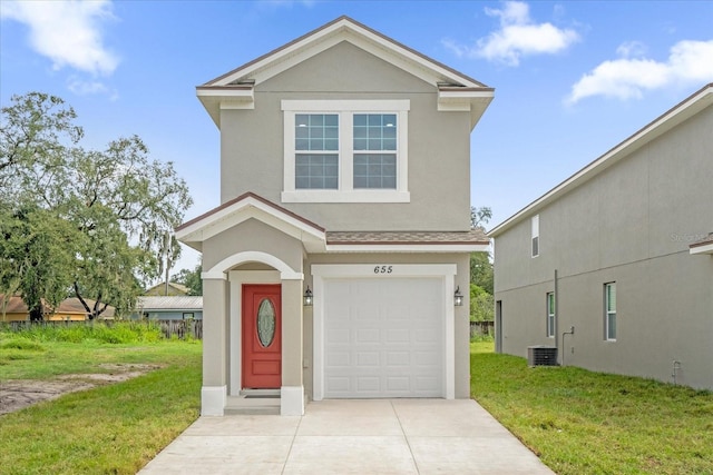 view of front property featuring a garage and a front yard