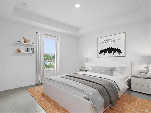 bedroom with a tray ceiling