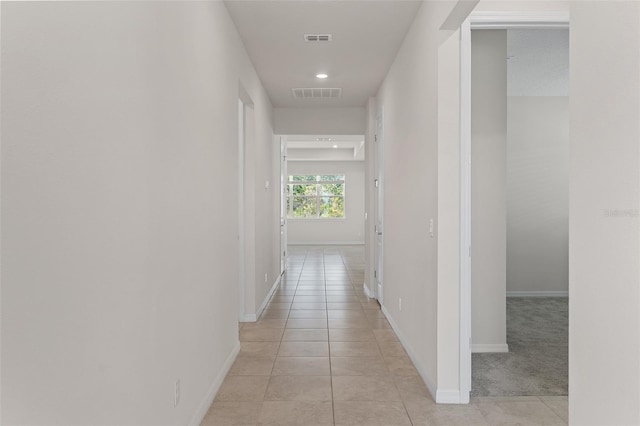 hallway with light tile patterned floors