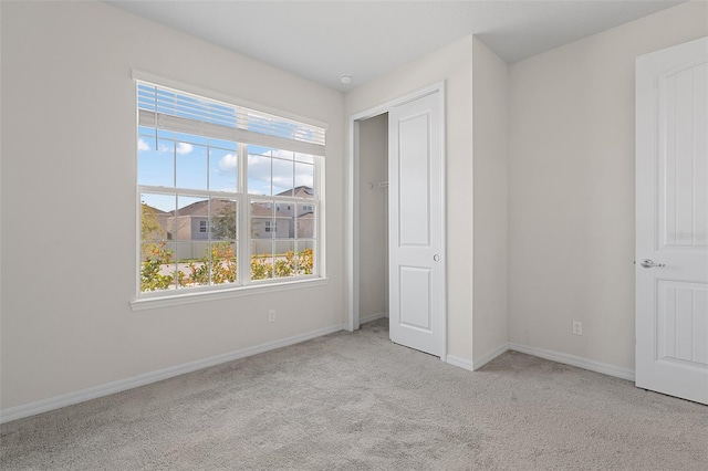 unfurnished bedroom with light carpet