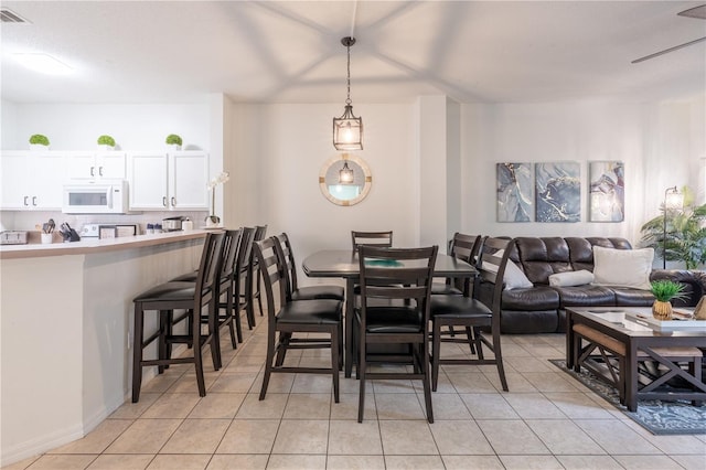 dining space with light tile patterned floors